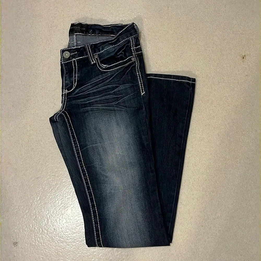 Twenty one black size 5/6 regular dark wash jeans.